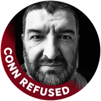 Black-and-white portrait of Cafer Şimşek inside a dark red ring that reads “CONN REFUSED”.